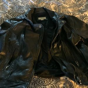 One of a kind vintage biker jacket in black size large. It’s a mini jacket